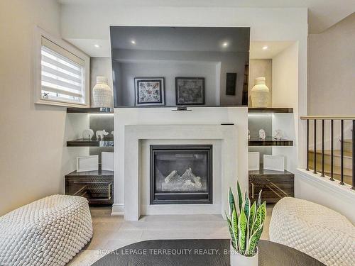 22-80 Daisy Ave, Toronto, ON - Indoor Photo Showing Living Room With Fireplace