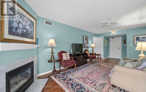 315 - 95 Wellington Street, Clarington (Bowmanville), ON - Indoor Photo Showing Living Room With Fireplace