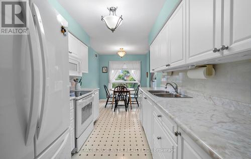 315 - 95 Wellington Street, Clarington (Bowmanville), ON - Indoor Photo Showing Kitchen With Double Sink