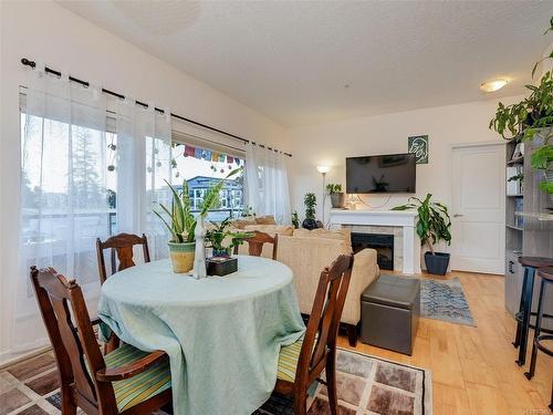 404-2747 Jacklin Rd, Langford, BC - Indoor Photo Showing Dining Room With Fireplace