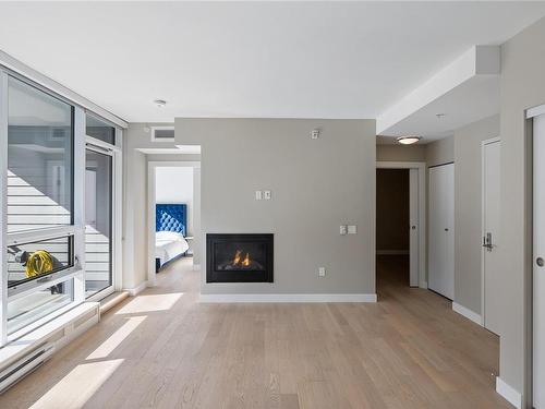 207-3529 Dolphin Dr, Nanoose Bay, BC - Indoor Photo Showing Living Room With Fireplace