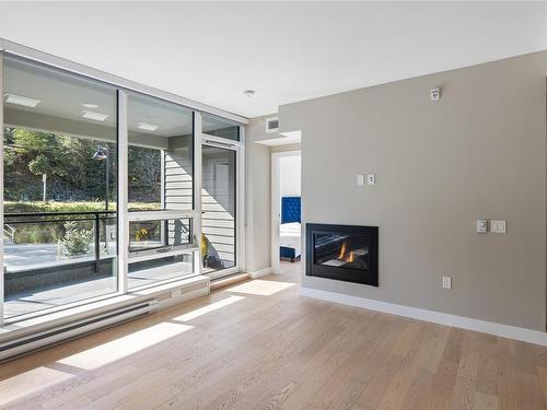 207-3529 Dolphin Dr, Nanoose Bay, BC - Indoor Photo Showing Living Room With Fireplace