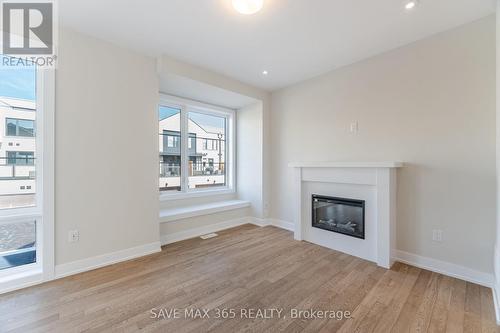 60 - 2273 Turnberry Road, Burlington, ON - Indoor Photo Showing Living Room With Fireplace