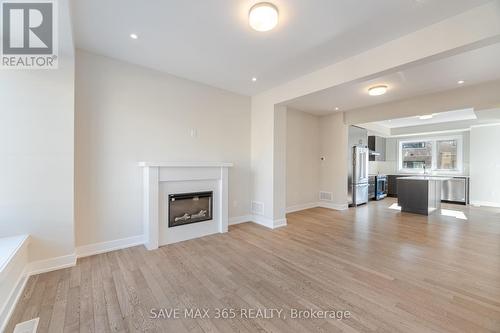 60 - 2273 Turnberry Road, Burlington, ON - Indoor Photo Showing Living Room With Fireplace