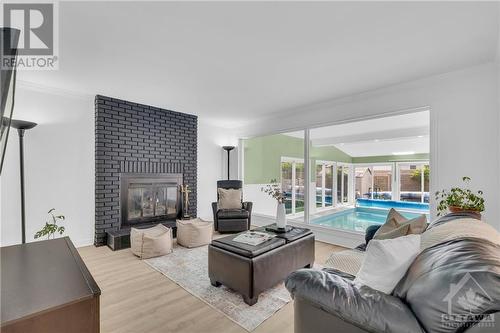 Family room with wood burning fireplace - 854 Explorer Lane, Ottawa, ON - Indoor Photo Showing Living Room With Fireplace