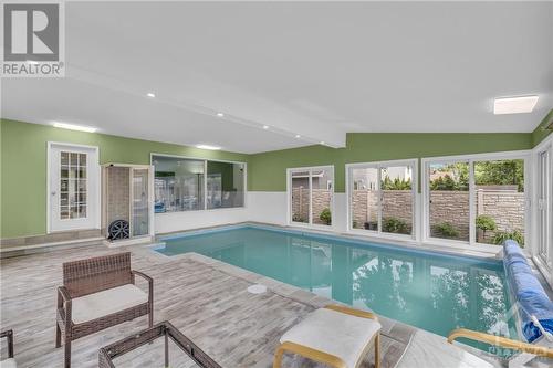 Enjoy swimming all year round! - 854 Explorer Lane, Ottawa, ON - Indoor Photo Showing Other Room With In Ground Pool