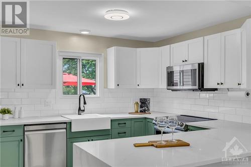 Gorgeous two-tone kitchen with dreamy apron sink - 854 Explorer Lane, Ottawa, ON - Indoor Photo Showing Kitchen With Upgraded Kitchen