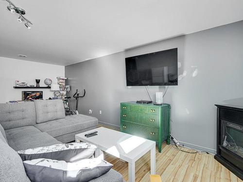 Family room - 14845 Rue Du Froment, Mirabel, QC - Indoor Photo Showing Living Room With Fireplace