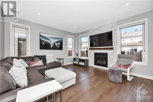 1115 Beckett Crescent, Ottawa, ON - Indoor Photo Showing Living Room With Fireplace