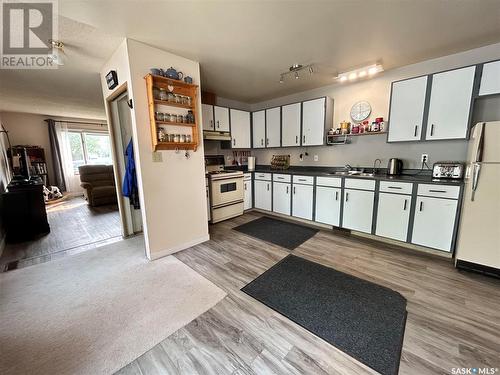 319 Barsness Bay, Richmound, SK - Indoor Photo Showing Kitchen With Double Sink