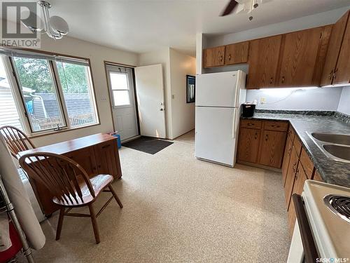 319 Barsness Bay, Richmound, SK - Indoor Photo Showing Kitchen With Double Sink