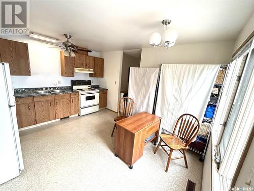 319 Barsness Bay, Richmound, SK - Indoor Photo Showing Kitchen With Double Sink