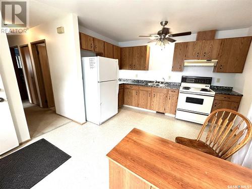 319 Barsness Bay, Richmound, SK - Indoor Photo Showing Kitchen With Double Sink