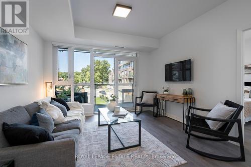 218 - 150 Logan Avenue, Toronto (South Riverdale), ON - Indoor Photo Showing Living Room