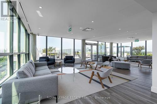 218 - 150 Logan Avenue, Toronto (South Riverdale), ON - Indoor Photo Showing Living Room