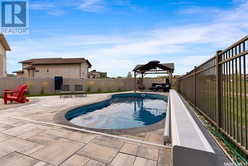 5245 Aviator Crescent, Regina, SK - Outdoor With In Ground Pool With Backyard