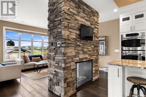 5245 Aviator Crescent, Regina, SK - Indoor Photo Showing Living Room With Fireplace