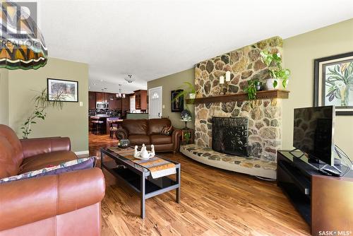 161 3Rd Street, Pilot Butte, SK - Indoor Photo Showing Living Room With Fireplace