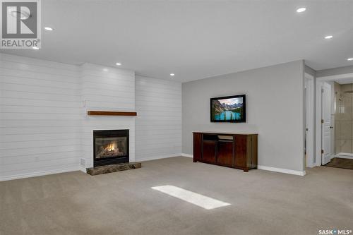 2015 E Ball Road, Regina, SK - Indoor Photo Showing Living Room With Fireplace