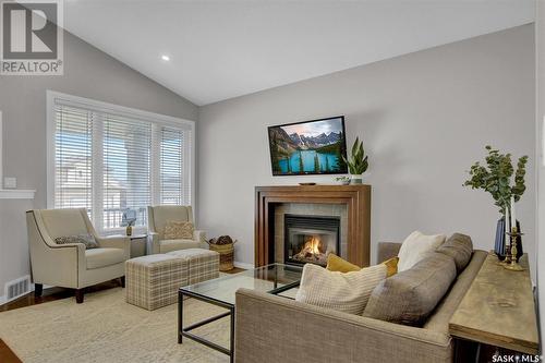 2015 E Ball Road, Regina, SK - Indoor Photo Showing Living Room With Fireplace