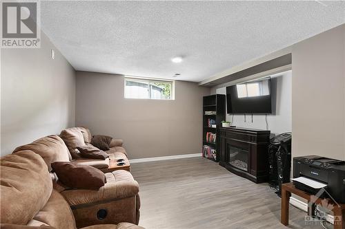 1 Chantilly Gate, Ottawa, ON - Indoor Photo Showing Basement With Fireplace