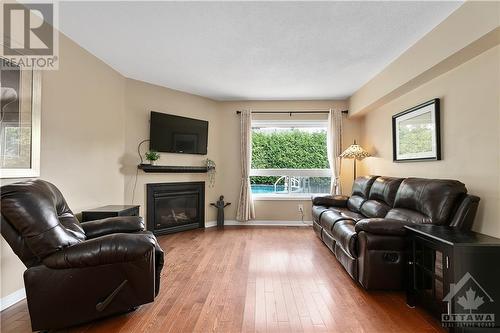 1 Chantilly Gate, Ottawa, ON - Indoor Photo Showing Living Room With Fireplace