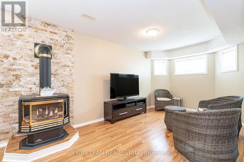 109 Dyer Drive, Wasaga Beach, ON - Indoor Photo Showing Living Room With Fireplace