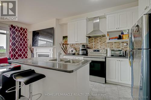 64 Finegan Circle, Brampton, ON - Indoor Photo Showing Kitchen With Double Sink