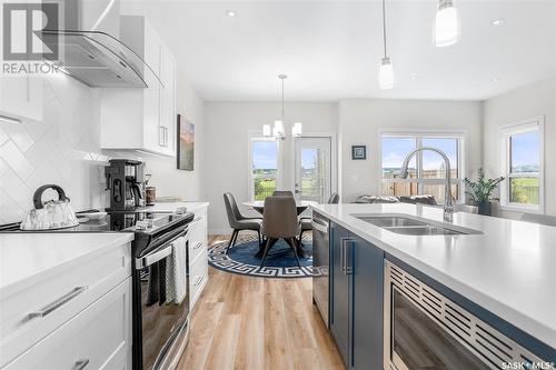 75 619 Evergreen Boulevard, Saskatoon, SK - Indoor Photo Showing Kitchen With Double Sink With Upgraded Kitchen