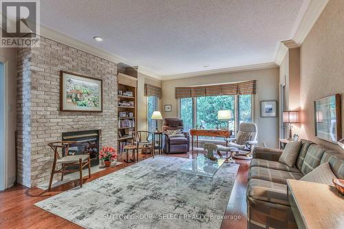 23 - 1200 Riverside Drive, London, ON - Indoor Photo Showing Living Room With Fireplace