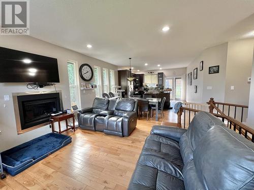 831 Funn Street, Quesnel, BC - Indoor Photo Showing Living Room With Fireplace