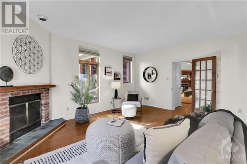 7 Clarey Avenue, Ottawa, ON - Indoor Photo Showing Living Room With Fireplace