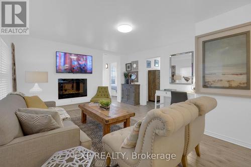 4 Oliver Drive, Tiny, ON - Indoor Photo Showing Living Room With Fireplace