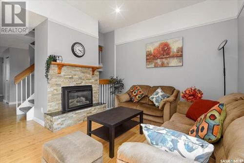 E 2 Lincoln Drive, Regina, SK - Indoor Photo Showing Living Room With Fireplace