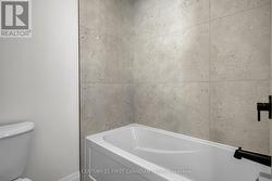 Upper level main bath W/C tub/shower - 