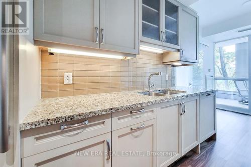 323 - 11 Bronte Road, Oakville, ON - Indoor Photo Showing Kitchen With Double Sink With Upgraded Kitchen