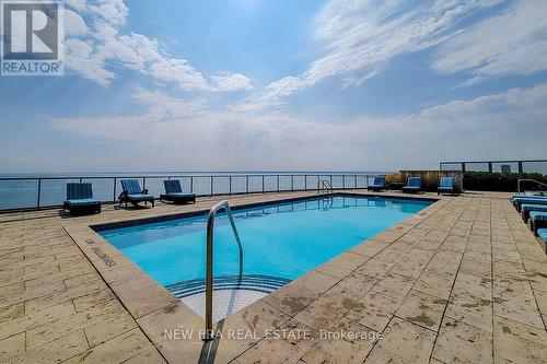 323 - 11 Bronte Road, Oakville (Bronte West), ON - Outdoor With In Ground Pool