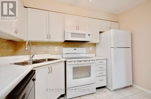 103 - 25 Meadow Lane, Barrie (Ardagh), ON - Indoor Photo Showing Kitchen With Double Sink