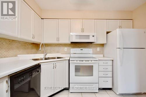 103 - 25 Meadow Lane, Barrie (Ardagh), ON - Indoor Photo Showing Kitchen With Double Sink