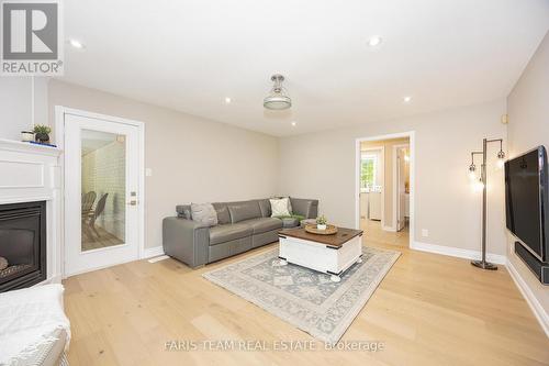 70 Copeland Creek Drive, Tiny, ON - Indoor Photo Showing Living Room With Fireplace