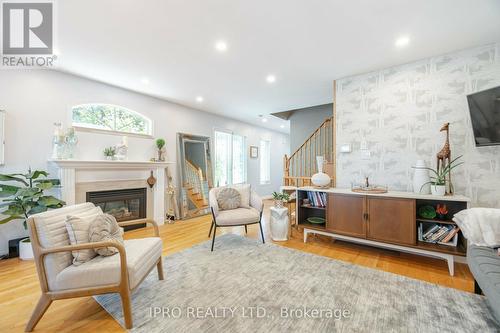 1 - 5555 Prince William Drive S, Burlington (Appleby), ON - Indoor Photo Showing Living Room With Fireplace