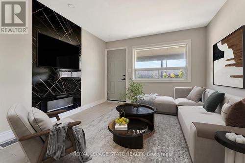 2009 Brampton Street, Hamilton (Parkview), ON - Indoor Photo Showing Living Room With Fireplace