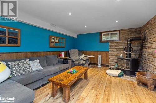 Lower Level Family Room - 12 Lakeshore Road, Mckellar, ON - Indoor Photo Showing Living Room With Fireplace