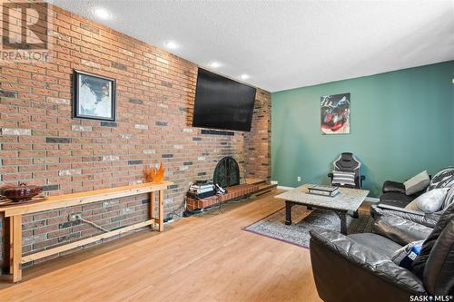 6139 7Th Avenue N, Regina, SK - Indoor Photo Showing Other Room With Fireplace