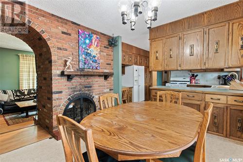 6139 7Th Avenue N, Regina, SK - Indoor Photo Showing Dining Room With Fireplace