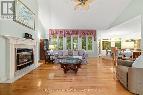 33 Yuill Crescent, Prince Edward County (Ameliasburgh), ON - Indoor Photo Showing Living Room With Fireplace