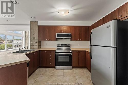 2175 Wyandotte Street East Unit# 212, Windsor, ON - Indoor Photo Showing Kitchen With Double Sink