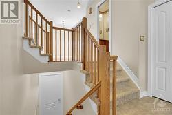 Bright open staircase from main to second floor - 