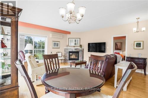 114 - 1404 Clement Street, Hawkesbury, ON - Indoor Photo Showing Dining Room With Fireplace