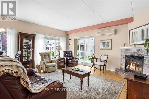 114 - 1404 Clement Street, Hawkesbury, ON - Indoor Photo Showing Living Room With Fireplace